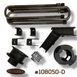 Product photo of Truxxx kit #108050-D for the 2024–2026 Ford F-450 and F-550 (DRW/Dually). The image showcases 2.5-inch front coil spacers and 2.5-inch precision-fabricated rear lift blocks. All components are manufactured from heavy-gauge USA Mill Certified Steel with a durable salt-resistant coat. Includes four high-strength custom U-bolts, heavy-duty shock brackets, and Grade 10.9/12.9 high-tensile fasteners.