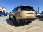 Rear angle of a 2027 Kia Telluride with Truxxx 2.5 inch front and rear lift kit with shock shaft extensions.